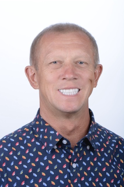 Male patient smiling after dental implant treatment