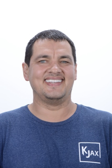 Male patient smiling after dental implant treatment