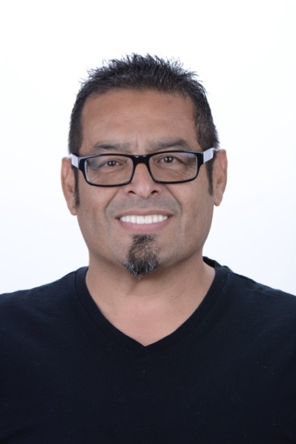 Male patient smiling after dental implant treatment