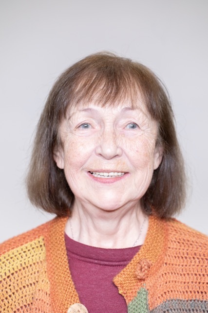 Female patient smiling after dental implant treatment